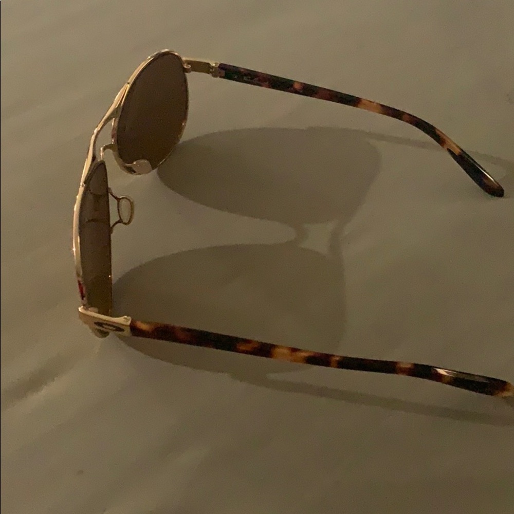 Gold Oakley aviator sunglasses